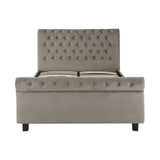 Grey upholstered king bed with a tufted headboard, featuring a storage ottoman base and sleek black legs. The design is modern and elegant, suitable for various bedroom styles