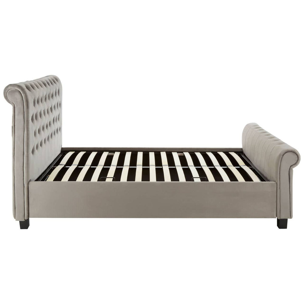 Grey ottoman king bed featuring a tufted headboard and side rails, with a slatted base for mattress support, set on short black legs