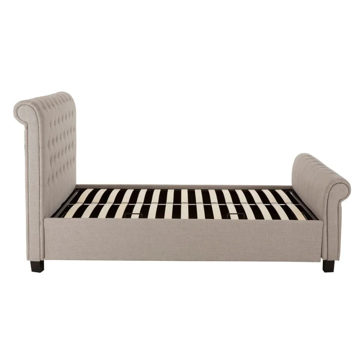 Grey fabric upholstered bed frame with tufted headboard and footboard, side view