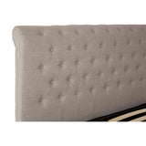Beige upholstered bed headboard with button-tufted design in close-up view