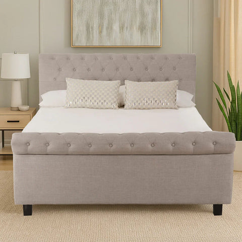 Light grey upholstered bed frame with button tufting in modern bedroom setting