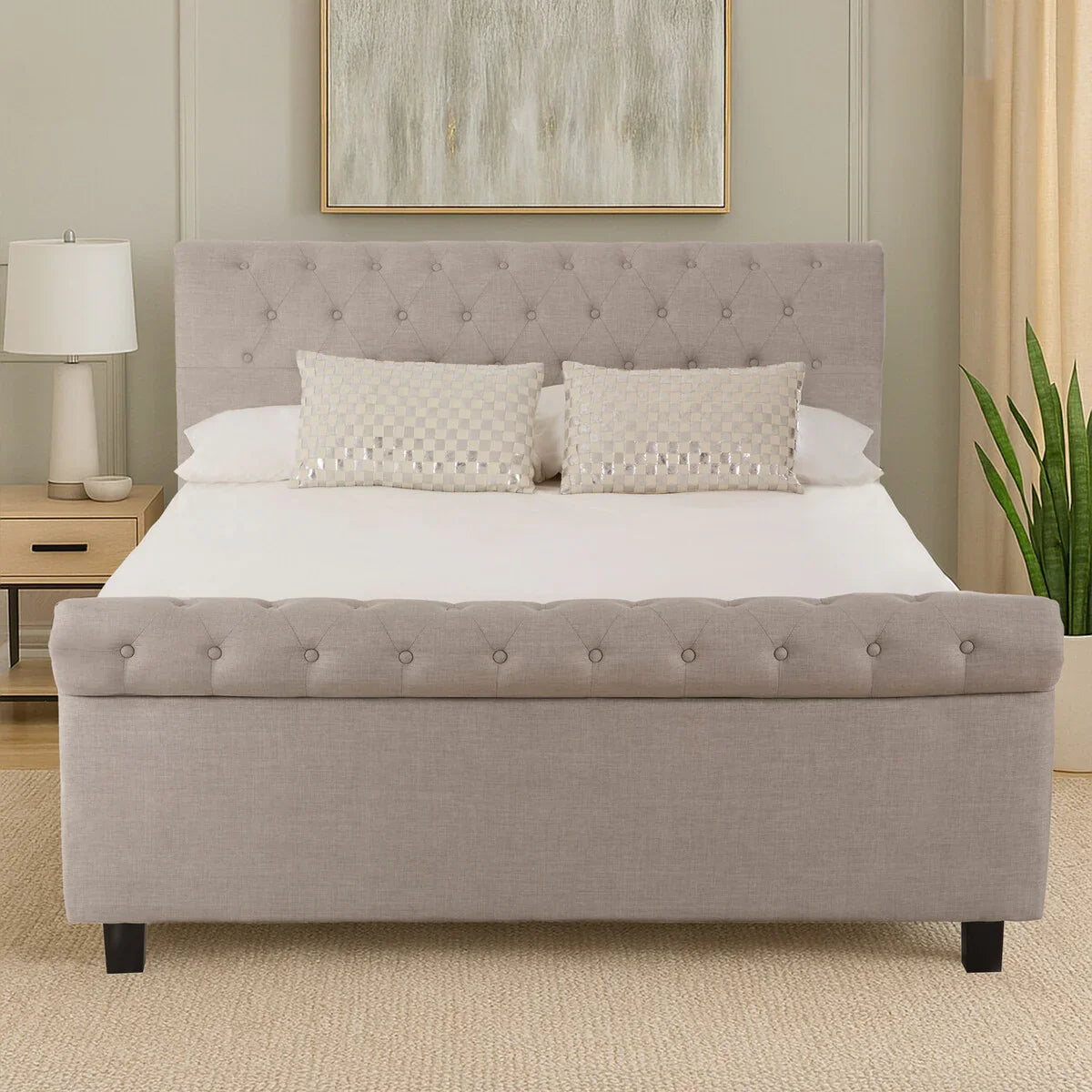 Light grey upholstered bed frame with button tufting in modern bedroom setting