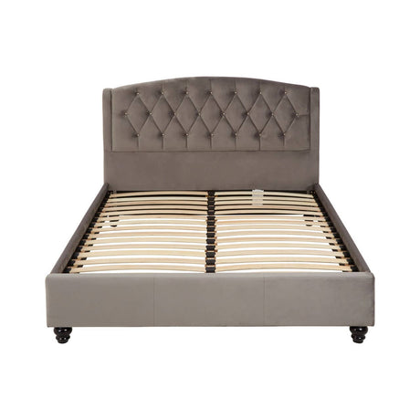 A double bed with a steel shade upholstered headboard featuring tufted detailing, a sturdy frame, and a slatted base for mattress support, set on four tapered legs
