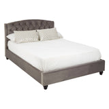 Double bed with a tufted steel shade headboard, featuring a low-profile frame and a white mattress. Two decorative pillows are placed at the head of the bed, and the bed stands on dark wooden legs