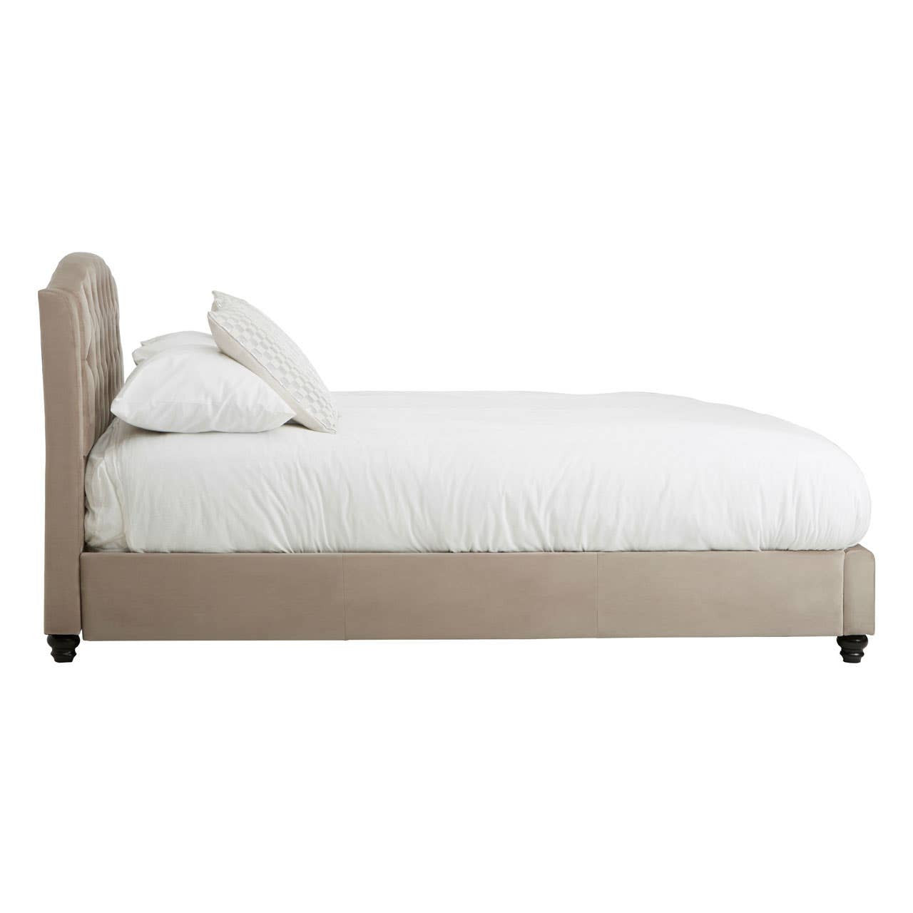 Mink brushed velvet double bed with a sleek, upholstered headboard and a plush white mattress. The bed features rounded edges and sits on four dark wooden legs, creating a modern and elegant look suitable for any bedroom decor. Two white pillows are placed on top of the mattress