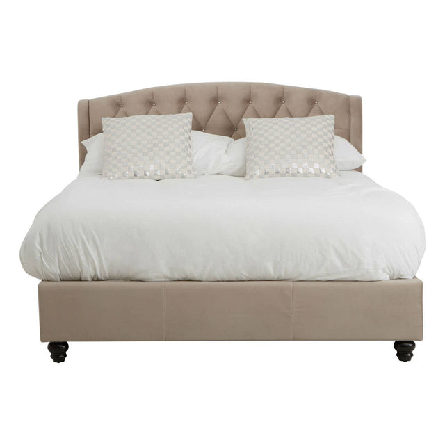 A double bed upholstered in mink brushed velvet with a tufted headboard, featuring two decorative pillows and a white bedding set, resting on dark wooden legs
