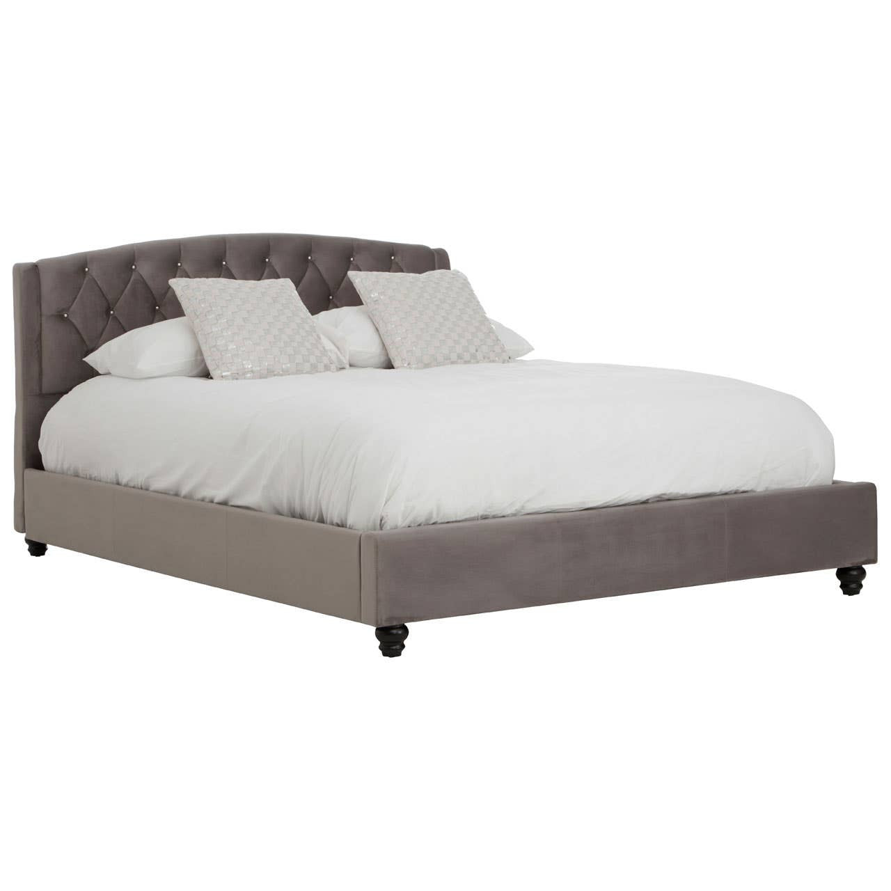 Grey velvet king bed with a tufted headboard, featuring two decorative pillows and a white comforter, resting on dark wooden legs