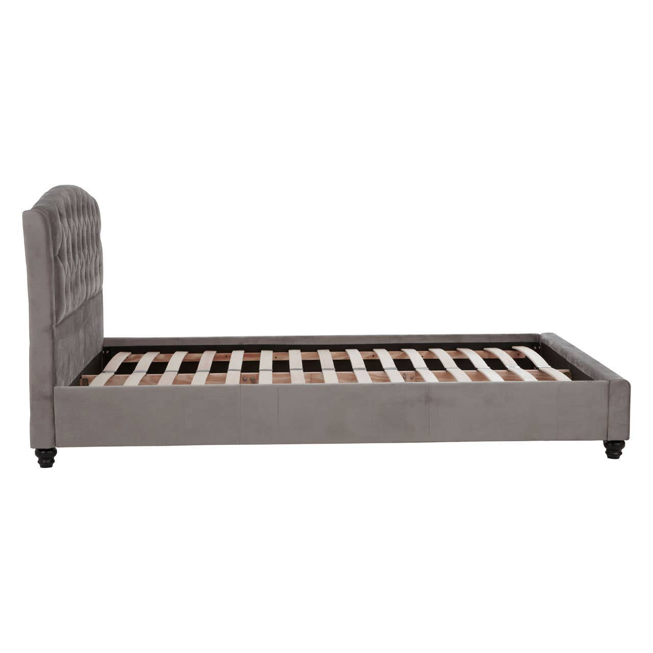 Grey velvet king bed with a tufted headboard and wooden slats for mattress support, featuring tapered legs and a sleek, modern design