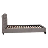 Grey velvet king bed with a tufted headboard and wooden slats for mattress support, featuring tapered legs and a sleek, modern design