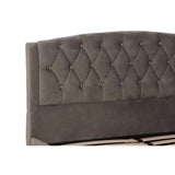 Grey velvet headboard with a tufted design featuring diamond-shaped patterns, showcasing a soft and luxurious texture. The headboard is slightly arched at the top, adding an elegant touch to the overall design