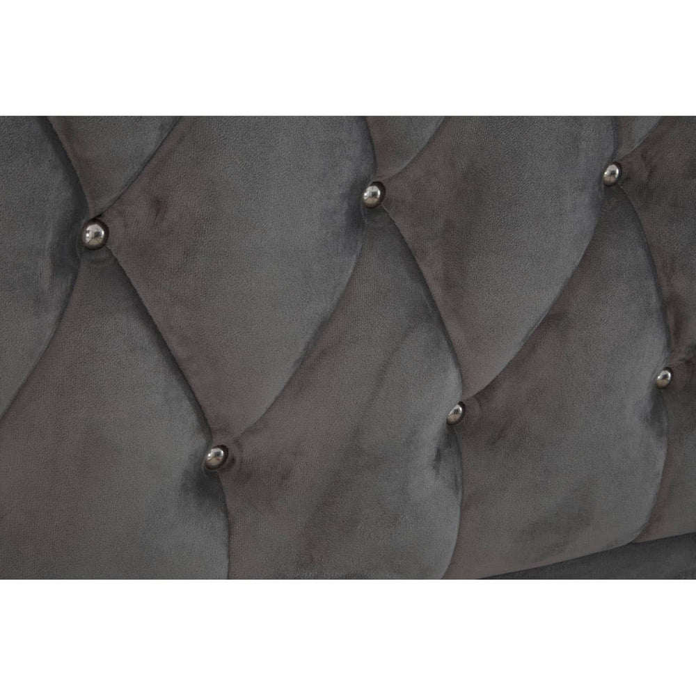 Grey velvet upholstery with a tufted design featuring diamond patterns and decorative buttons, showcasing a luxurious texture suitable for a king-sized bed