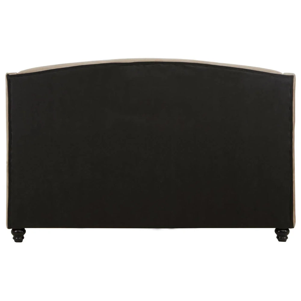 Back view of upholstered bed frame with black fabric panel and turned wooden legs