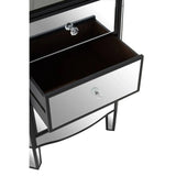 Mirrored bedside table with two drawers and glass handles, one drawer slightly open