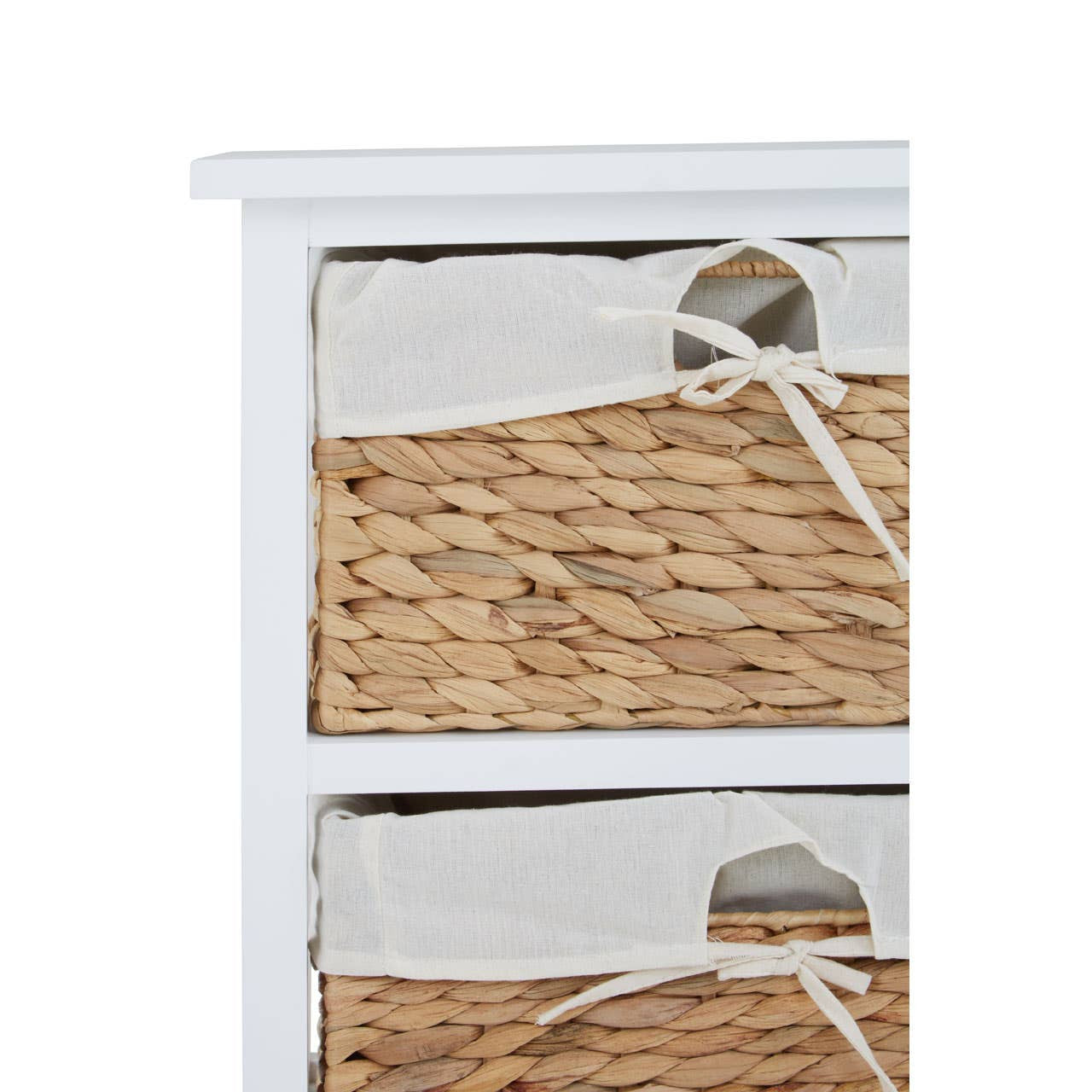 A white wooden chest featuring three woven seagrass drawers, each with a fabric lining and tied with a decorative bow. The top of the chest has a smooth, flat surface