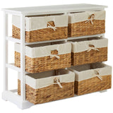 A white wooden chest featuring six seagrass drawers with fabric liners, arranged in two rows. The drawers have a natural woven texture and are designed with fabric handles for easy opening. The overall design is modern and functional, suitable for home organization
