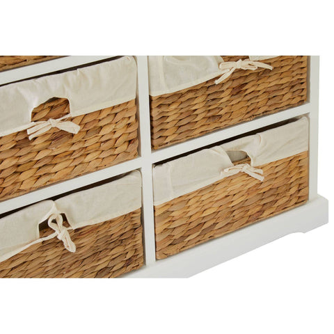 A close-up view of the Ashby 6 Seagrass Drawer Chest, showcasing four woven seagrass drawers with fabric liners and cut-out handles, set against a white wooden frame