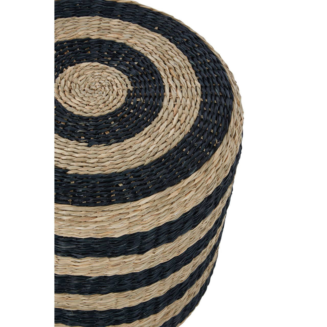 Round pouffe made from seagrass, featuring alternating black and natural tan stripes. The texture is woven, showcasing a circular pattern with a smooth top surface