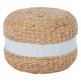 Round pouffe made from natural water hyacinth, featuring a textured woven design with a prominent white stripe around its center. The pouffe has a light brown color, showcasing the organic material's natural fibers