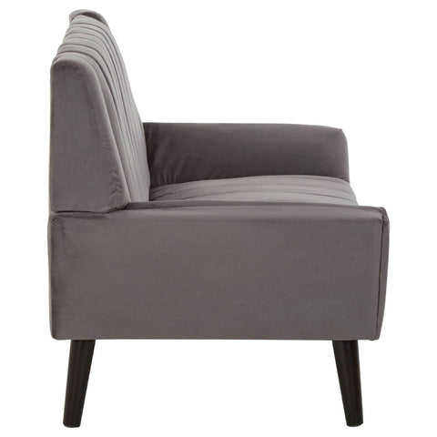 A side view of a two-seat grey sofa featuring a sleek design, with a straight backrest and slightly curved armrests. The sofa is supported by four dark wooden legs, giving it a modern and minimalist appearance. The upholstery is a soft grey fabric, creating a neutral and versatile look suitable for various interior styles