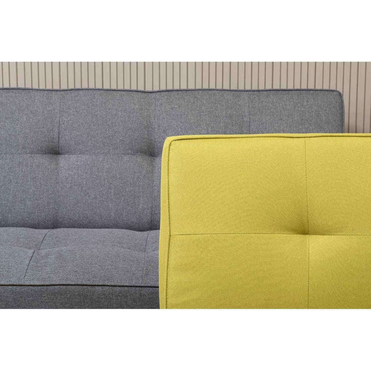 Yellow fabric sofa in front of grey fabric sofa with button tufted details