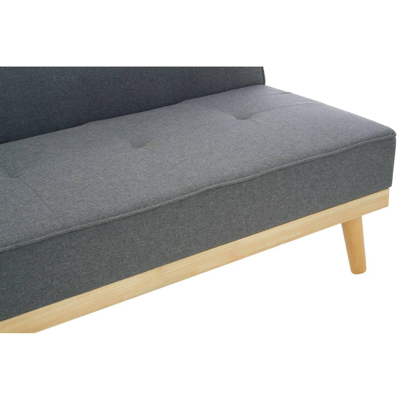 Grey fabric sofa seat with tufted cushion and light wood legs, angled side view