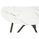 Round dining table featuring a white marble effect surface with subtle gray veining, supported by sleek black legs. The set includes six matching chairs with a modern design, complementing the table's aesthetic