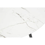 Round dining table featuring a white marble effect surface with subtle gray veining, supported by a sleek black base. The image focuses on the tabletop, highlighting its smooth finish and elegant design