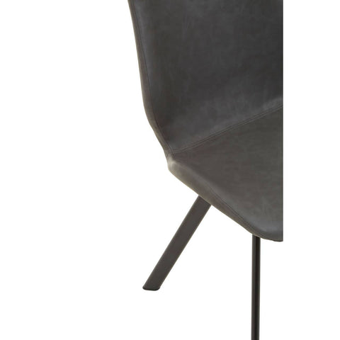 Close-up view of a dark gray chair with a sleek, modern design, featuring a curved backrest and a black metal leg. The chair is part of a dining set that includes a round table with a marble effect surface and five additional matching chairs