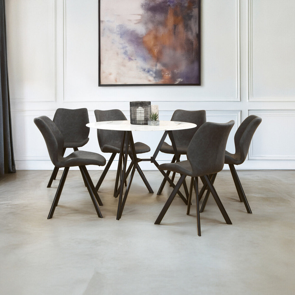 Round dining table with a marble effect top surrounded by six upholstered chairs with dark frames, set in a modern dining area featuring a neutral color palette and a large abstract artwork on the wall. The floor is light-colored, enhancing the contemporary aesthetic of the space