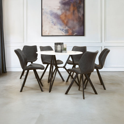 Round dining table with a marble effect top surrounded by six upholstered chairs with dark frames, set in a modern dining area featuring a neutral color palette and a large abstract artwork on the wall. The floor is light-colored, enhancing the contemporary aesthetic of the space