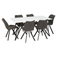 A rectangular dining table with a white marble effect top, surrounded by six modern chairs with dark gray upholstery and black legs, arranged in a spacious layout