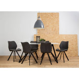 A modern dining set featuring a rectangular marble effect table surrounded by six sleek black chairs with wooden legs. The table is set against a light-colored wall and a textured wooden backdrop, with a pendant light hanging above. The floor is a warm wood tone, enhancing the contemporary aesthetic of the arrangement