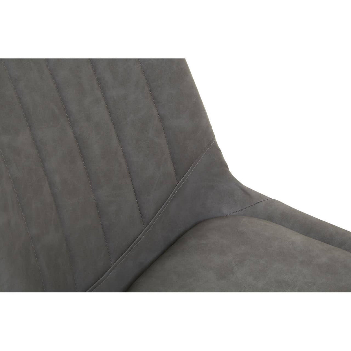 Close-up view of a gray upholstered dining chair featuring vertical stitching on the backrest, showcasing a modern design suitable for a dining table set