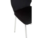 Black dining chair with a sleek, curved backrest and a soft seat, supported by slender metal legs. The chair's design is modern and minimalist, showcasing a contemporary aesthetic suitable for various dining spaces
