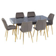 Smoked glass dining table with a rectangular top, accompanied by six upholstered chairs featuring gray fabric and golden metal legs. The set is arranged with the table in the center and chairs positioned around it, showcasing a modern and elegant design suitable for dining spaces