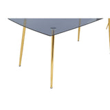 Smoked glass dining table with a triangular top and sleek gold legs, accompanied by six matching chairs featuring a modern design. The table's surface reflects light, enhancing the contemporary aesthetic of the set