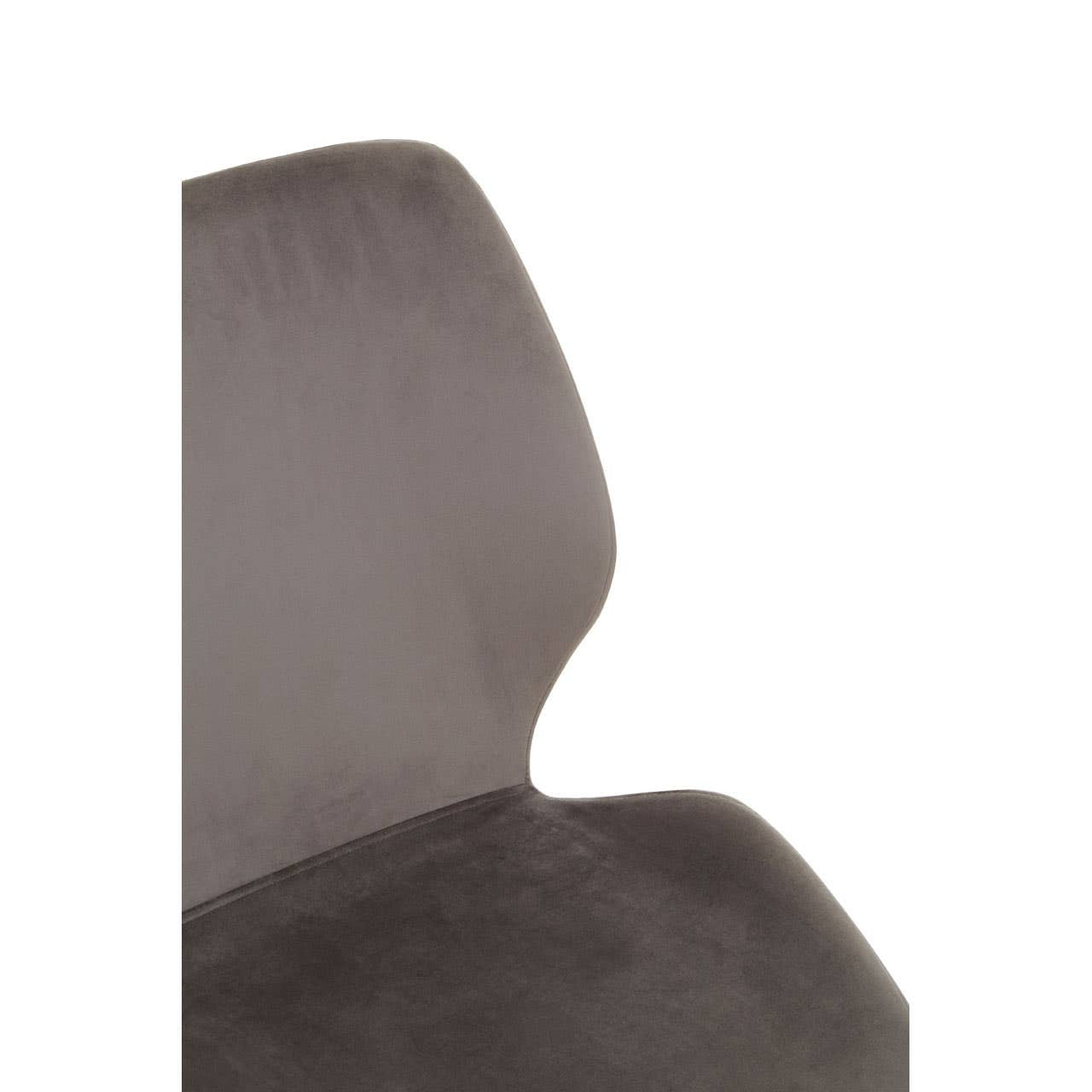 Close-up view of a gray upholstered dining chair with a curved backrest, showcasing soft fabric texture and a modern design