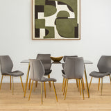 Smoked glass dining table surrounded by six modern gray chairs with wooden legs, set on a light wooden floor. A large abstract artwork in earthy tones hangs on the wall behind the table