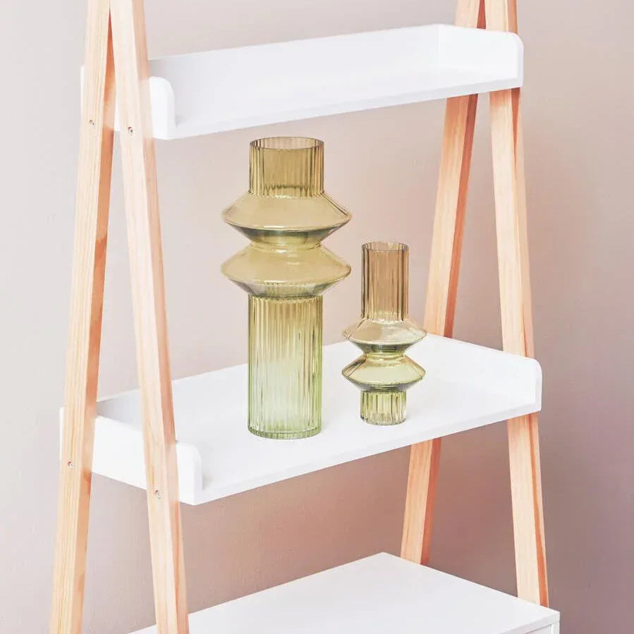 Wood and white ladder shelf with two ribbed glass vases displayed on middle shelf