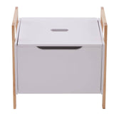 White storage box with a smooth surface and a cut-out handle, supported by light wooden legs. The box features a hinged lid that opens to reveal a spacious interior for organizing items