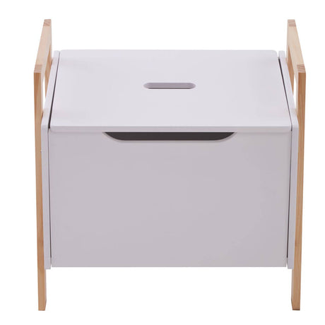 White storage box with a smooth surface and a cut-out handle, supported by light wooden legs. The box features a hinged lid that opens to reveal a spacious interior for organizing items