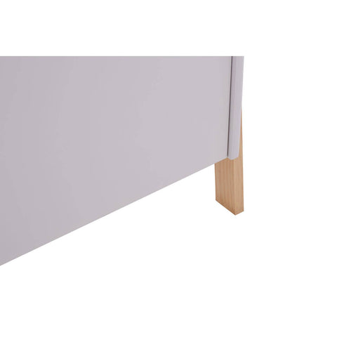 White storage box with a smooth surface and a light wooden leg, partially visible from the side. The box features a minimalist design, suitable for home organization
