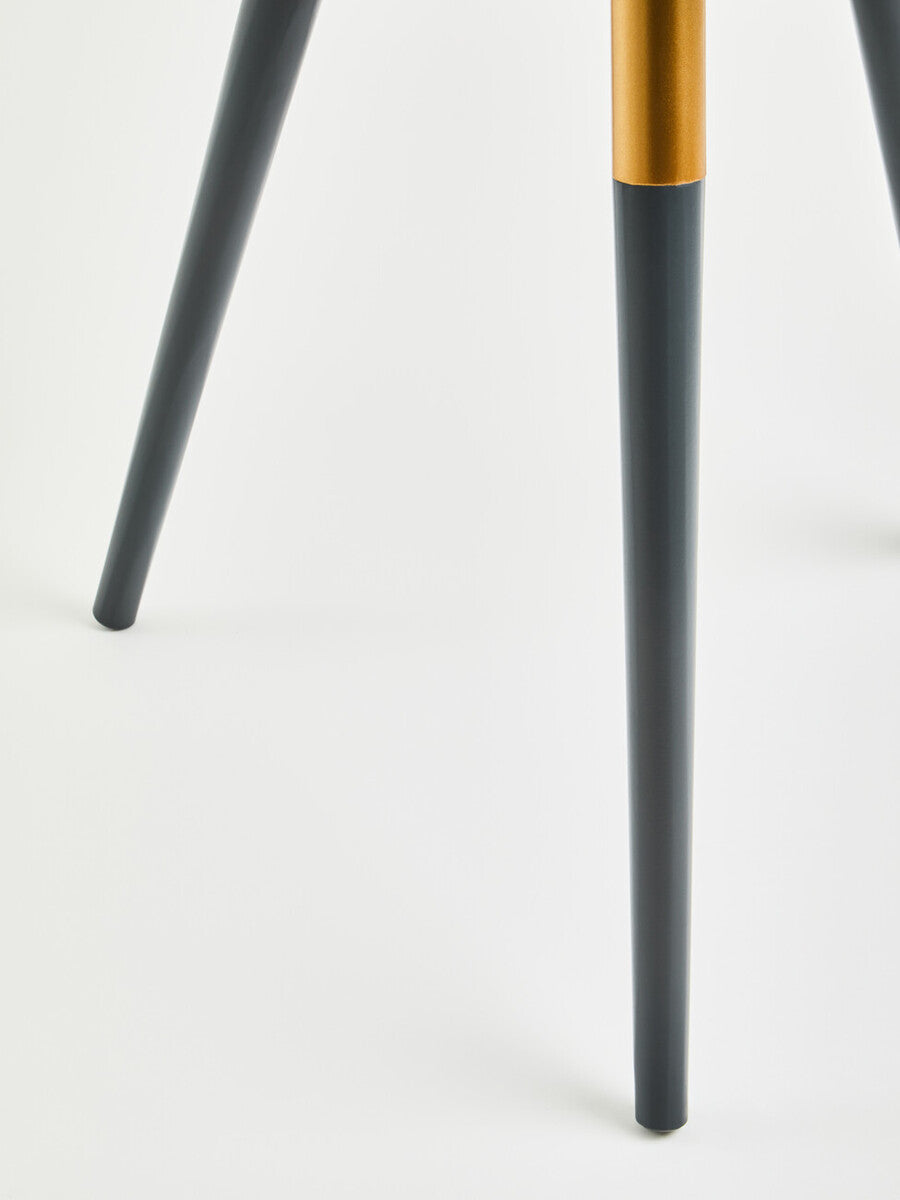 Dark grey side table leg with a tapered design, featuring a smooth finish and a contrasting golden accent near the base. The table leg is set against a light-colored background, emphasizing its modern aesthetic
