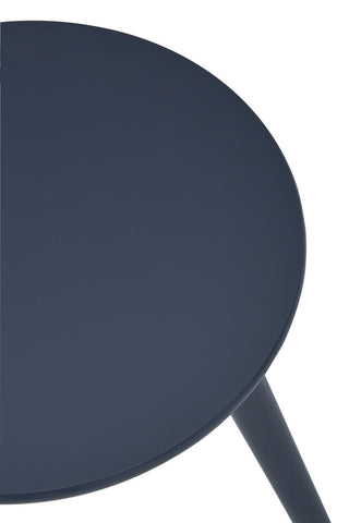 Round dark grey side table with a smooth surface and slender, angled legs. The design is modern and minimalistic, suitable for various home decor styles