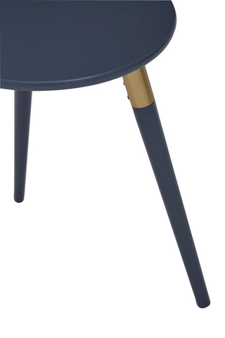 A dark grey side table with a round top and three tapered legs, one of which features a gold accent near the base. The table has a modern design suitable for home decor