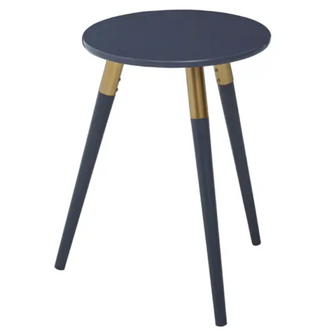 Round dark grey side table with three tapered legs, two of which are dark grey and one is natural wood. The table has a smooth surface and a modern design, suitable for various home decor styles