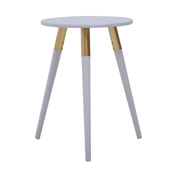 Light grey round side table with three tapered legs, two of which are light grey and one is natural wood, creating a modern and minimalist design suitable for various home decor styles