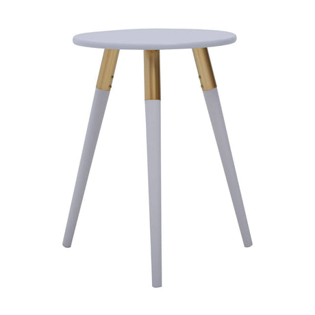 Light grey round side table with three tapered legs, two of which are light grey and one is natural wood, creating a modern and minimalist design suitable for various home decor styles