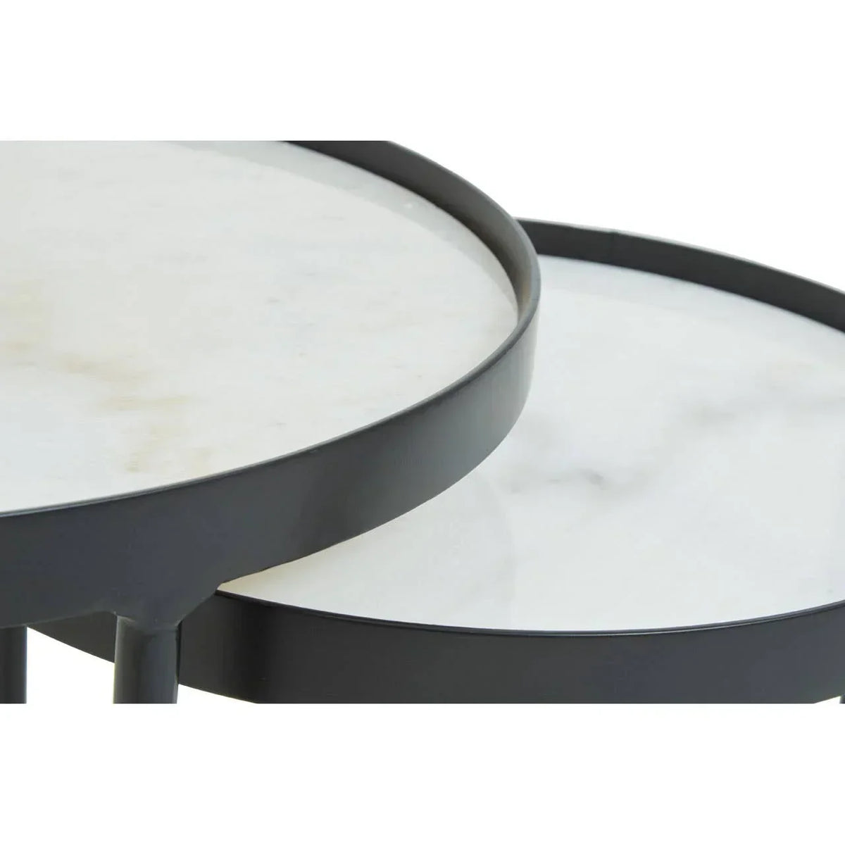 Closeup of white marble nesting coffee table tops with black metal frames