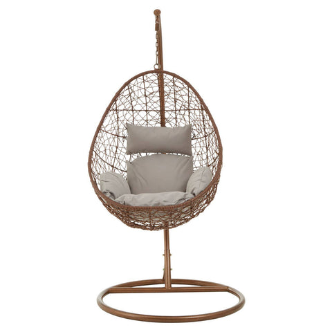 Brown rattan hanging chair with an egg-shaped design, featuring a cushioned seat in a light gray color and supported by a sturdy circular base. The chair is suspended from a vertical pole, creating a stylish and modern look suitable for indoor or outdoor use